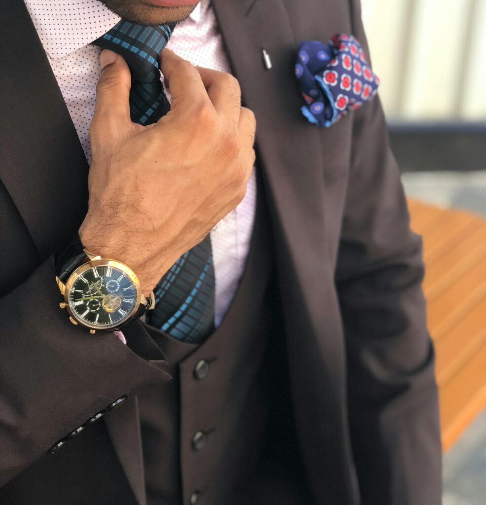 Businessman adjusting his tie.